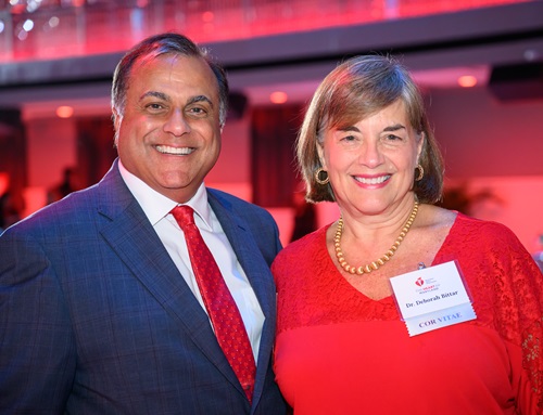 Photo of a man and woman smiling.